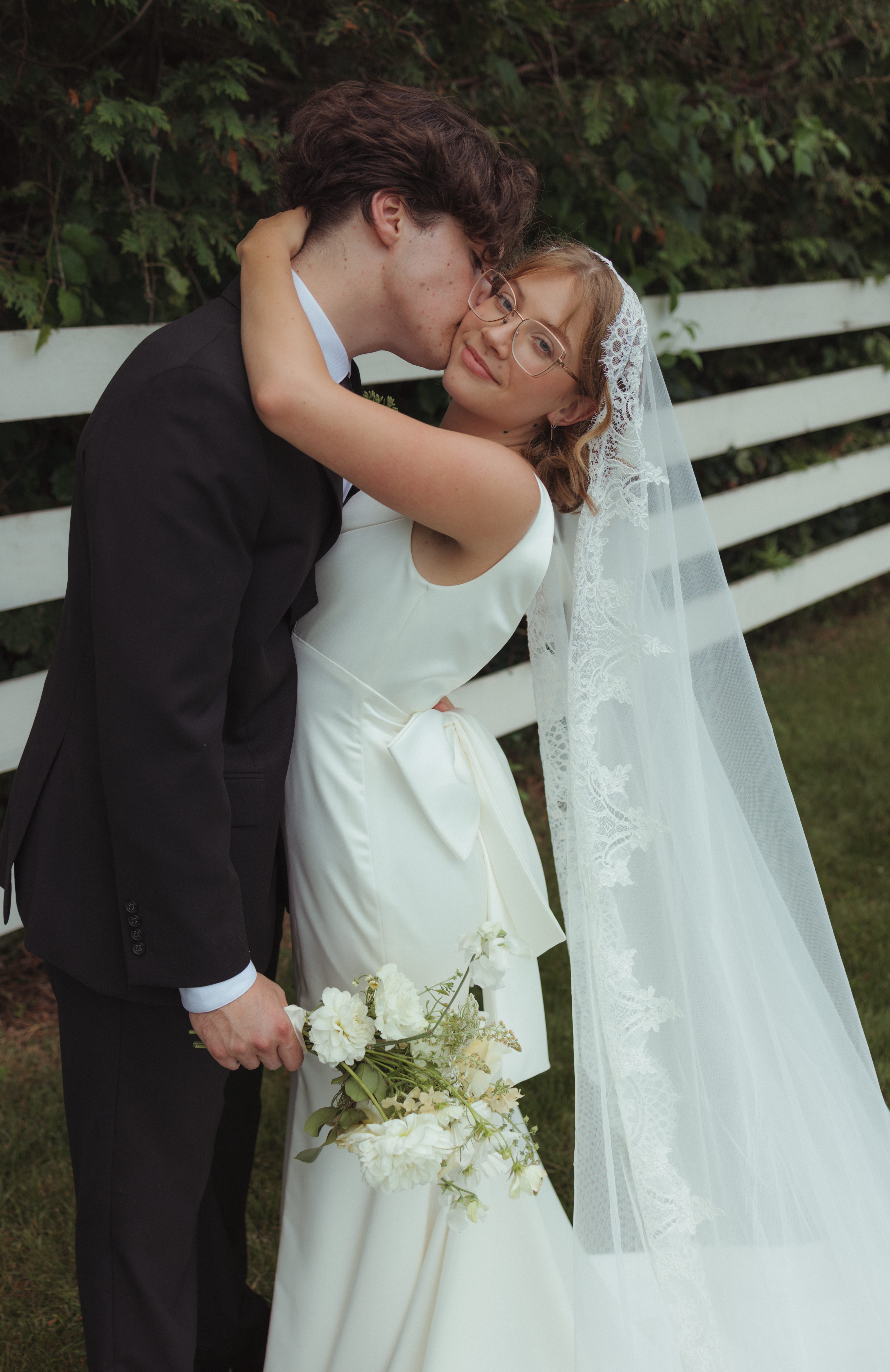 bride and groom pose for top ottawa wedding photographer