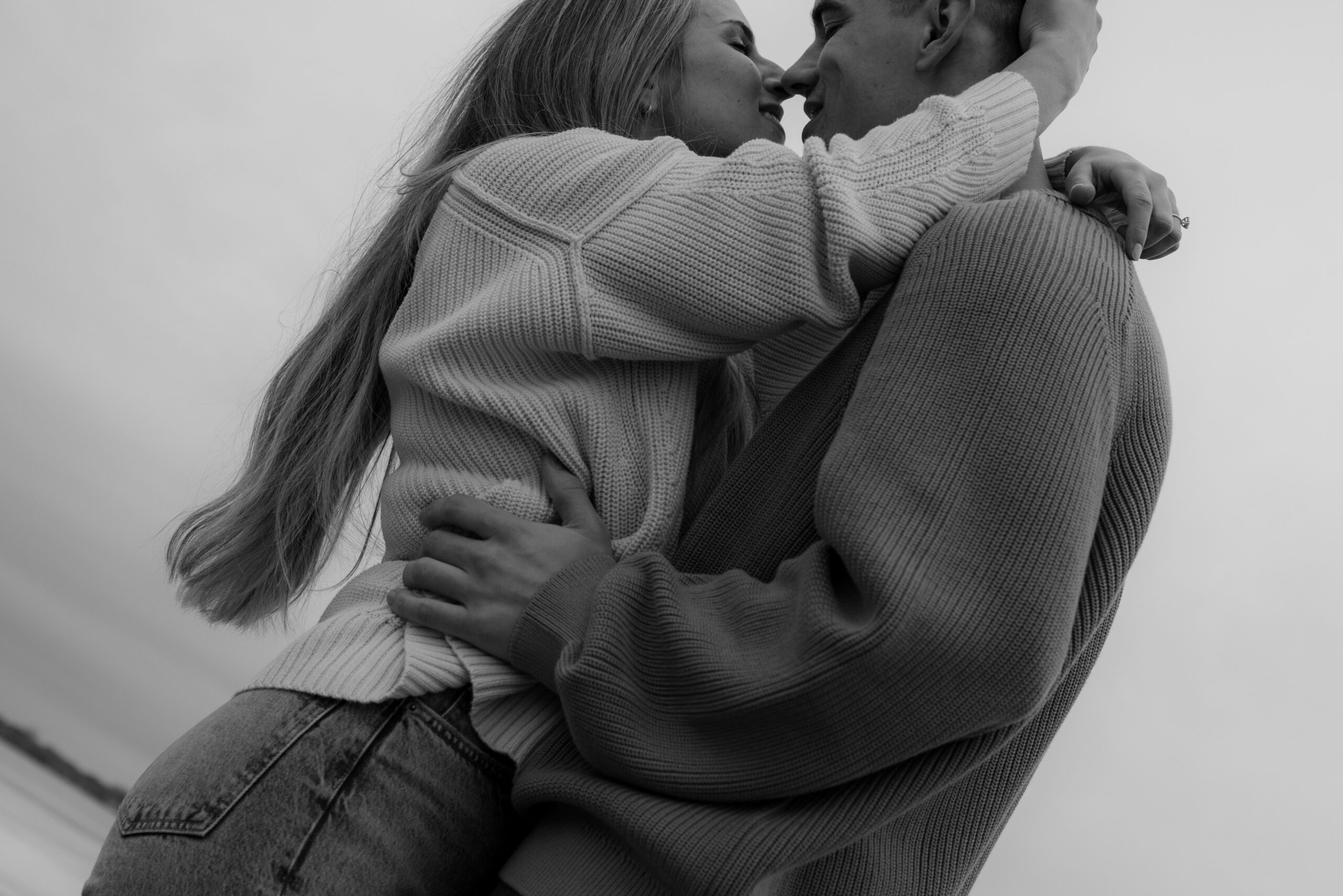 beautiful couple embracing eachother during their chilly spring engagement session