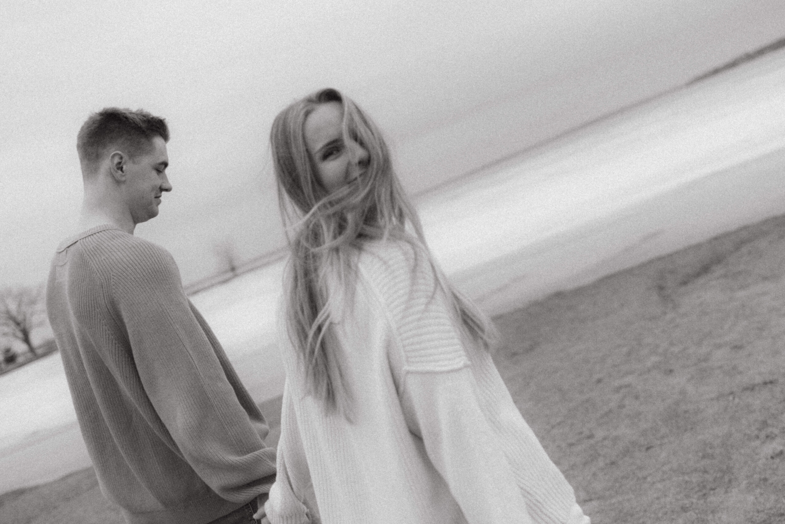 engagement session on beach on a chilly spring day