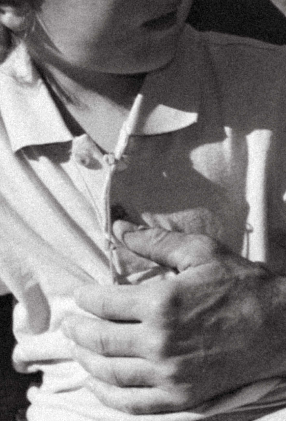 dads hand holding onto his child