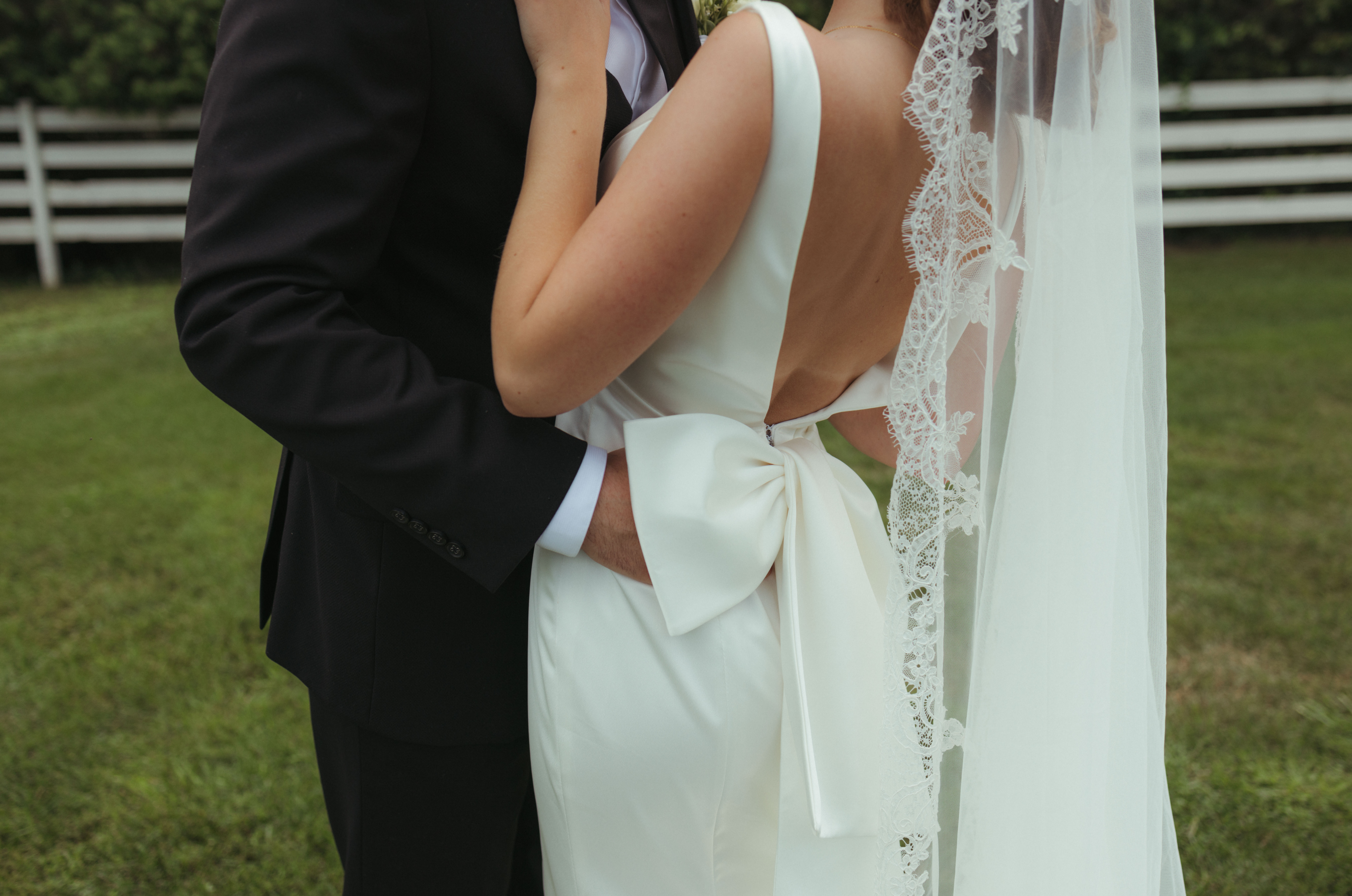 chic details of sleek wedding dress with bow