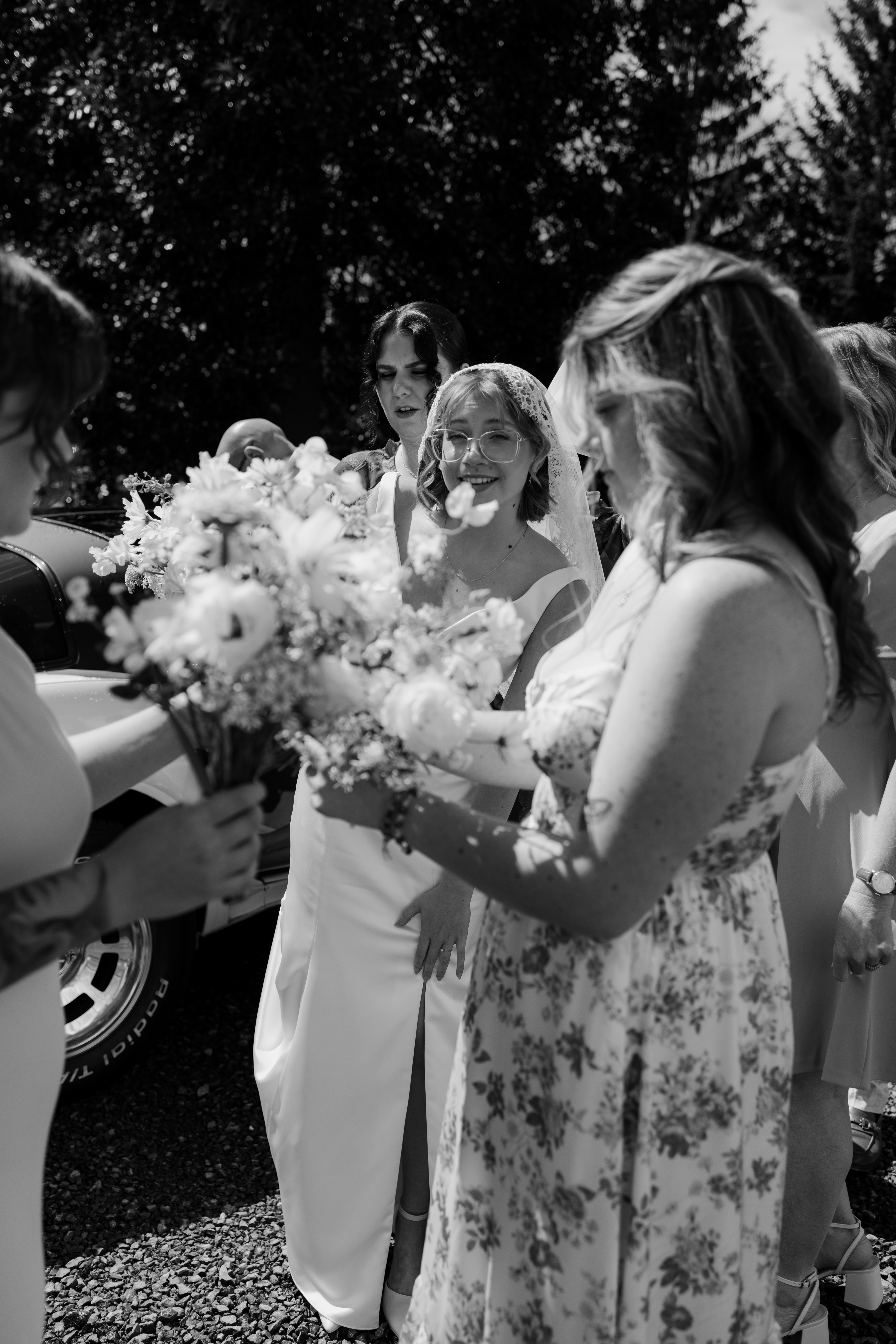 beautiful candid moment as bride gets ready to walk down the aisle with bridesmaids
