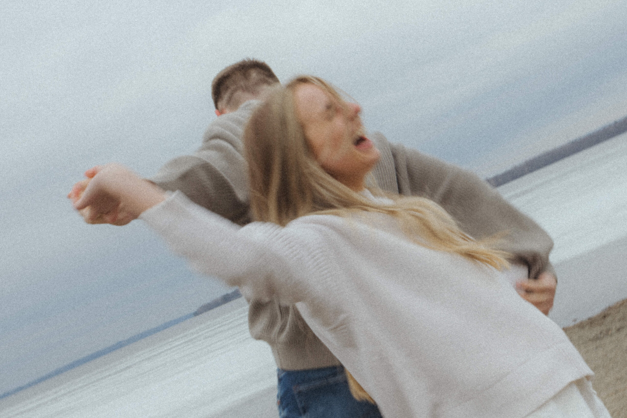 couple engagement session, candid moments on the beach