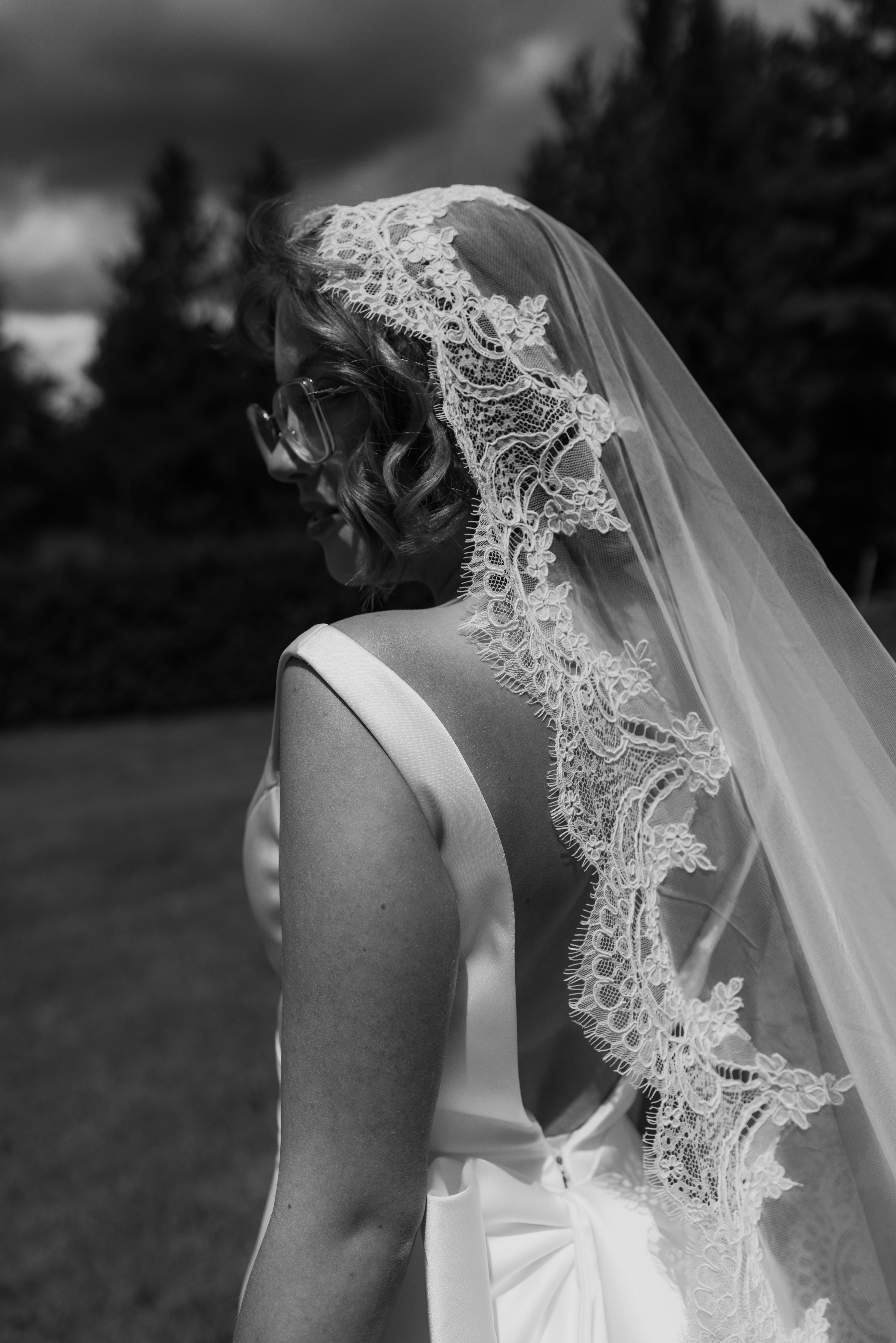 chic bridal portrait with lace veil and gown 