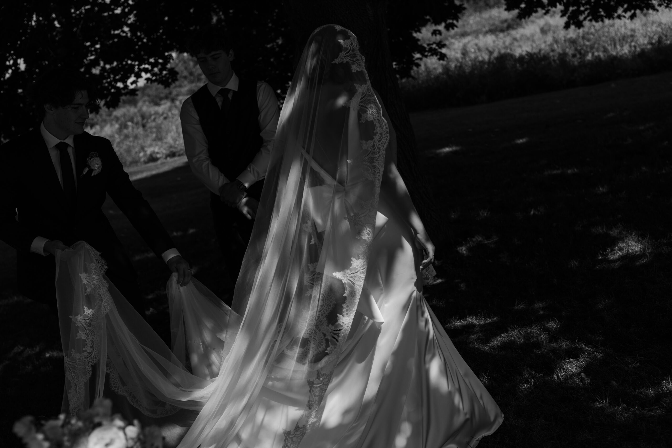 sunlight hitting the brides gown during the signing at their summer outdoor ceremony