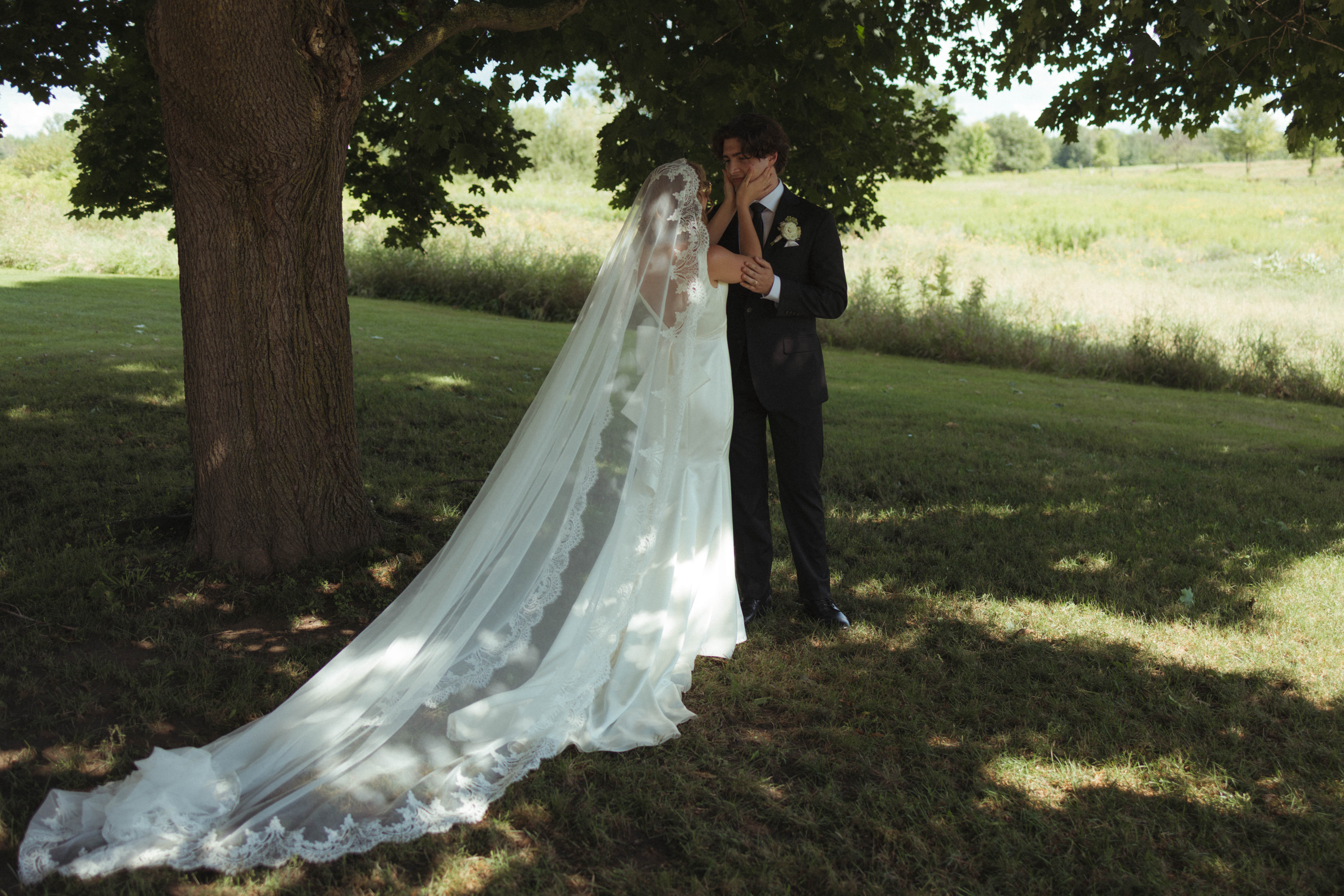 bride and groom share a moment during the signing as their outdoor ceremony