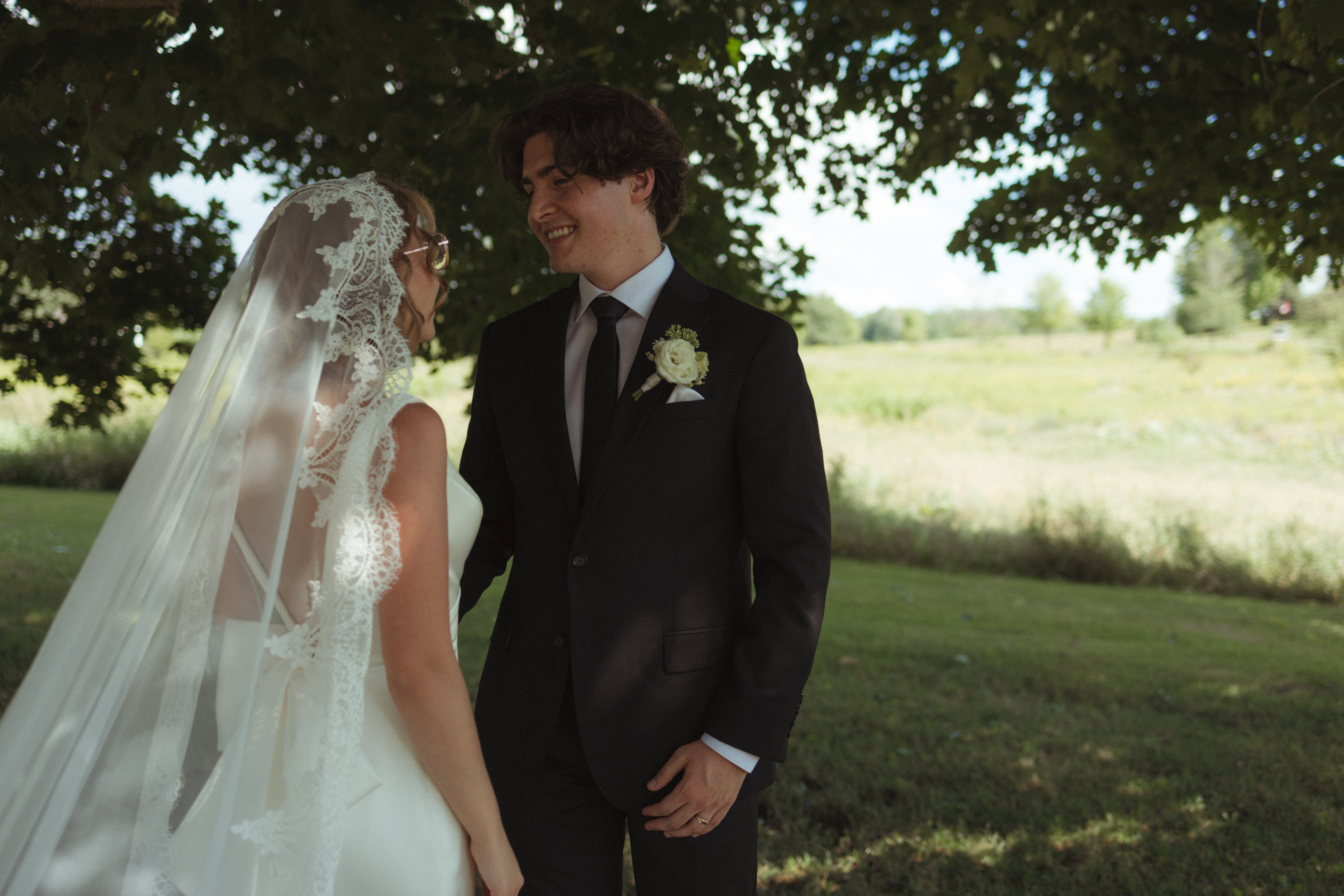 bride and groom smiling during ceremony