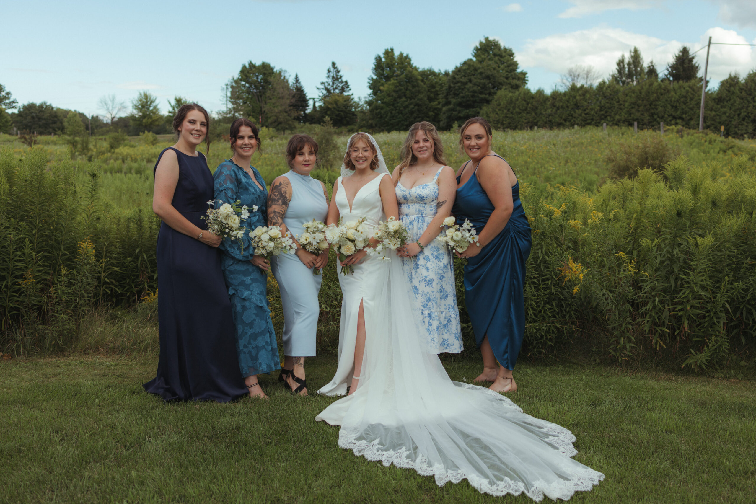 stylish bridal party in mixed textures and shades of blue