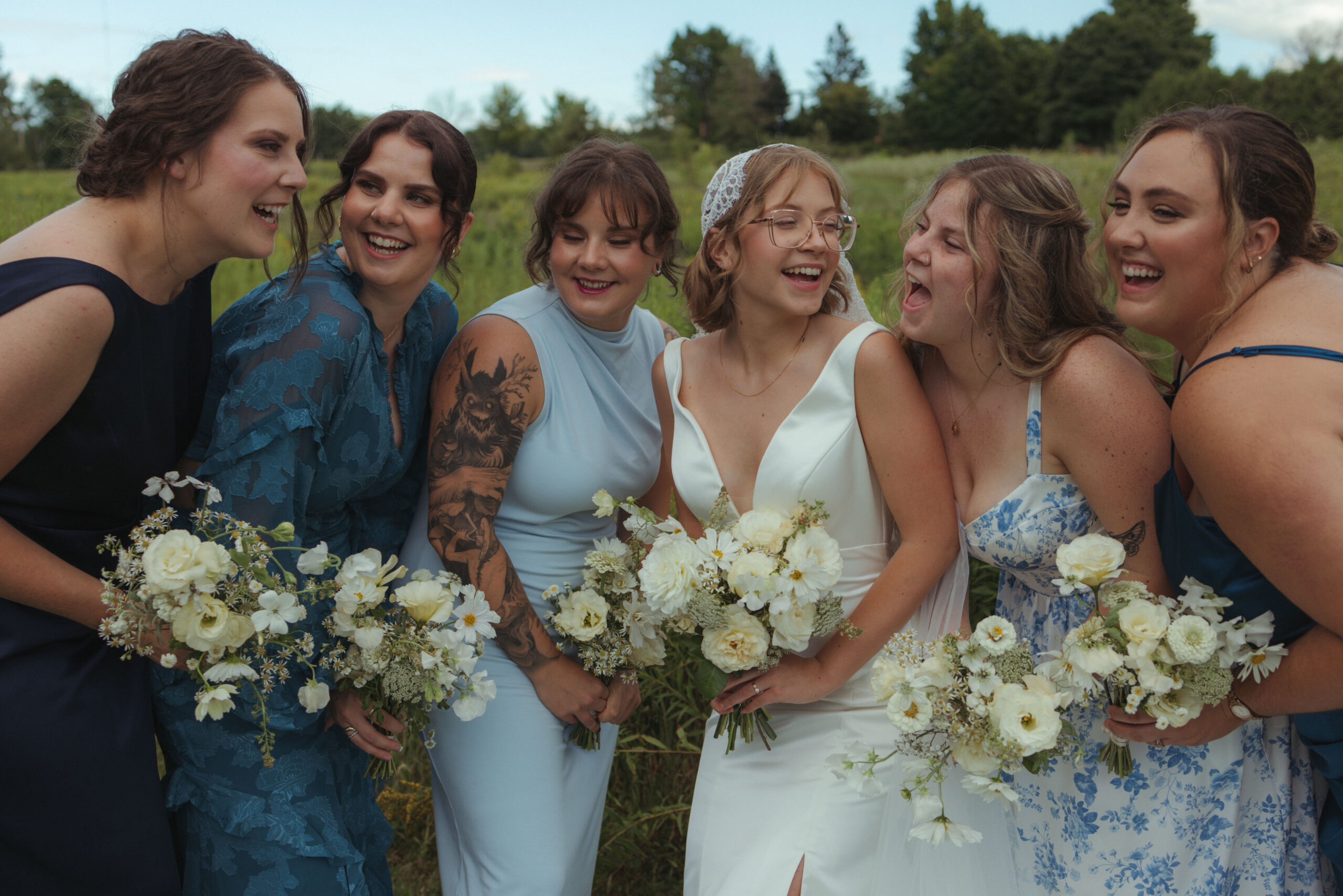 bridesmaids and bride smiling