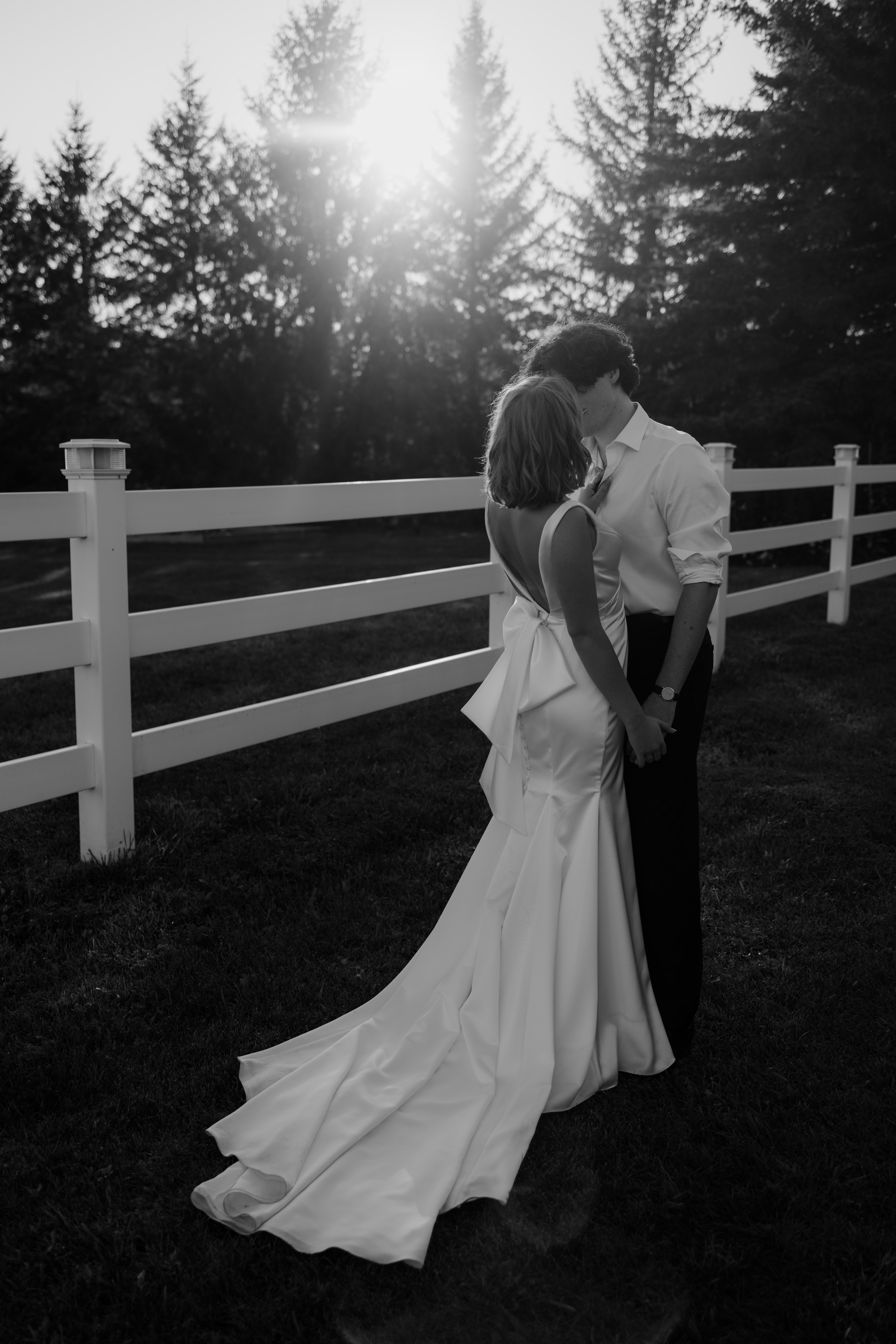 bride and groom share a kiss during golden hour