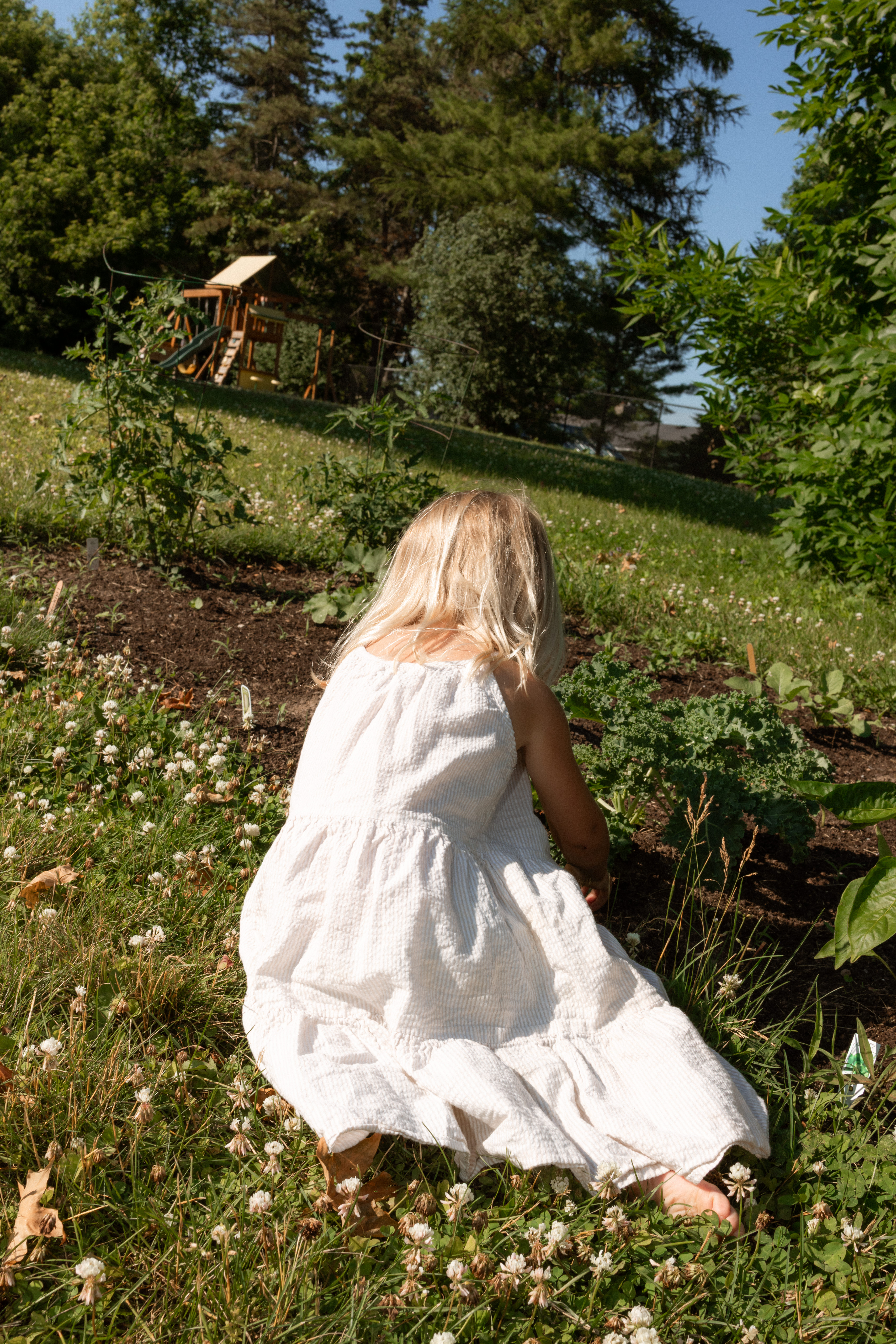 documentary garden barefoot candid moment of little girl 
