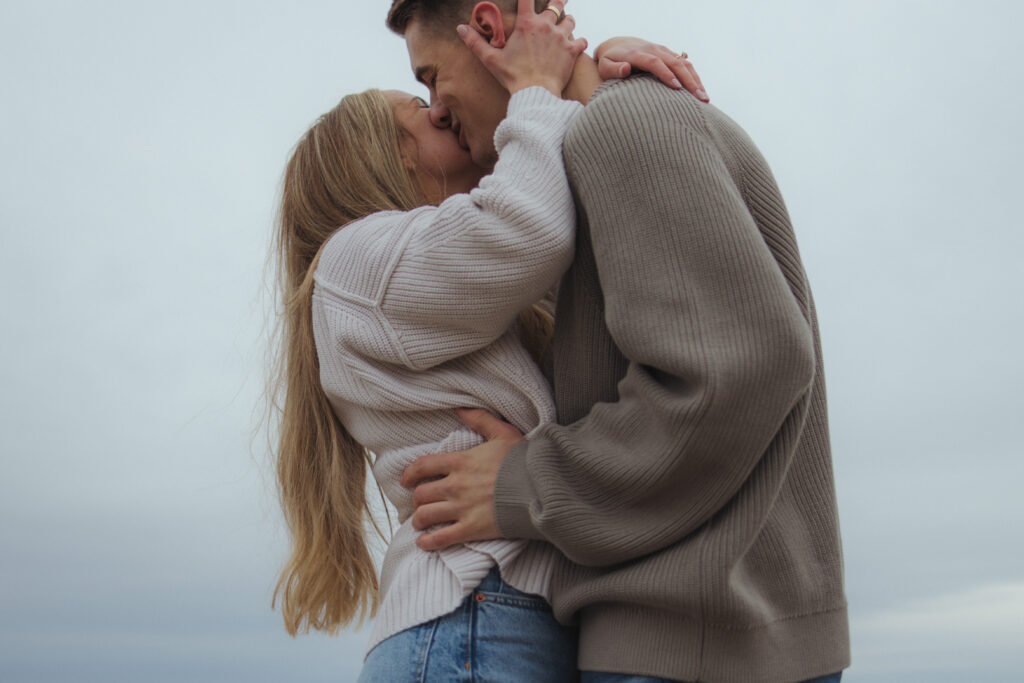 documentary ottawa photographer captures candid moment between couple during a chilly spring engagement session