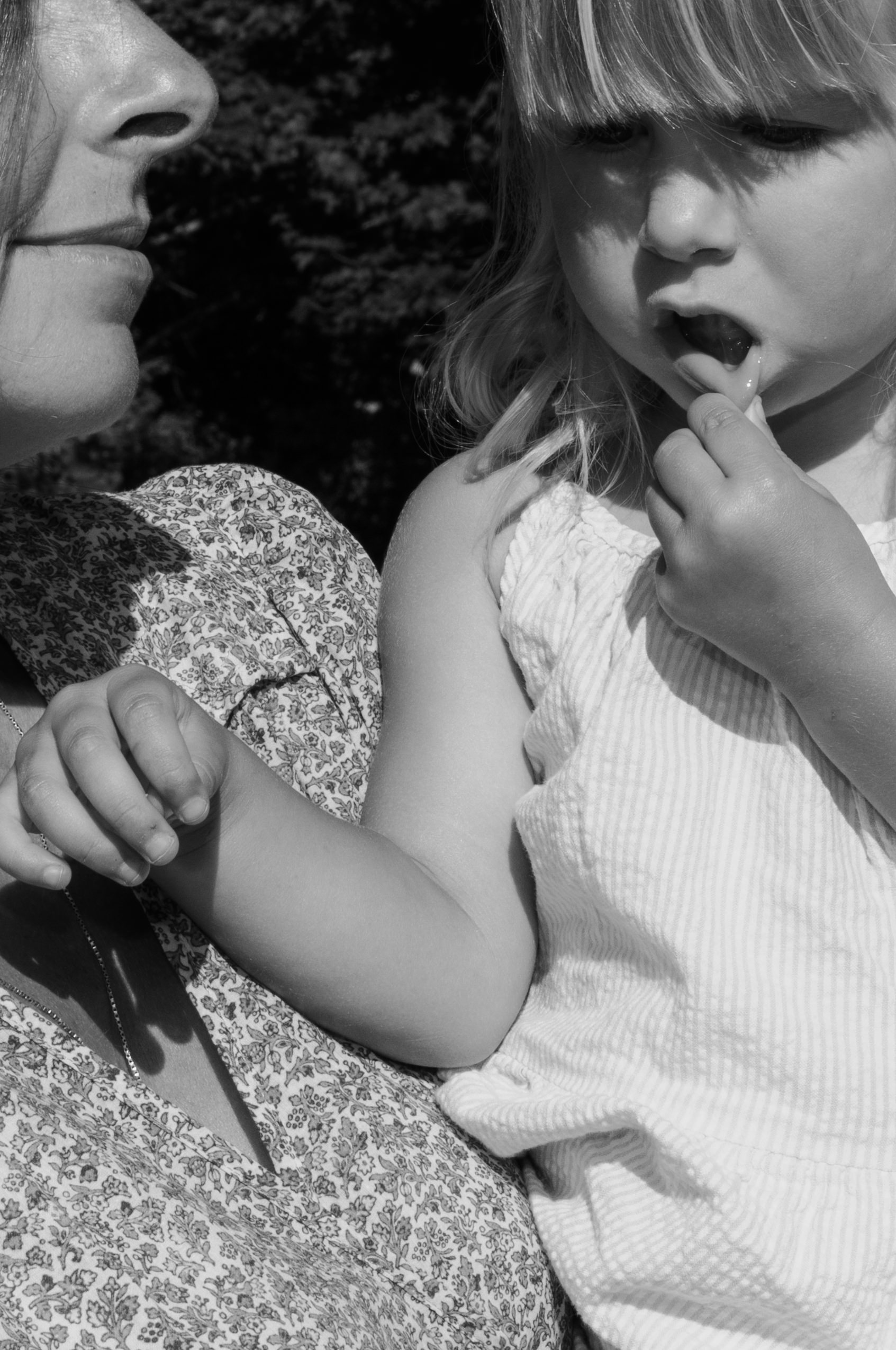 candid moment between mother and daughter during documentary family session