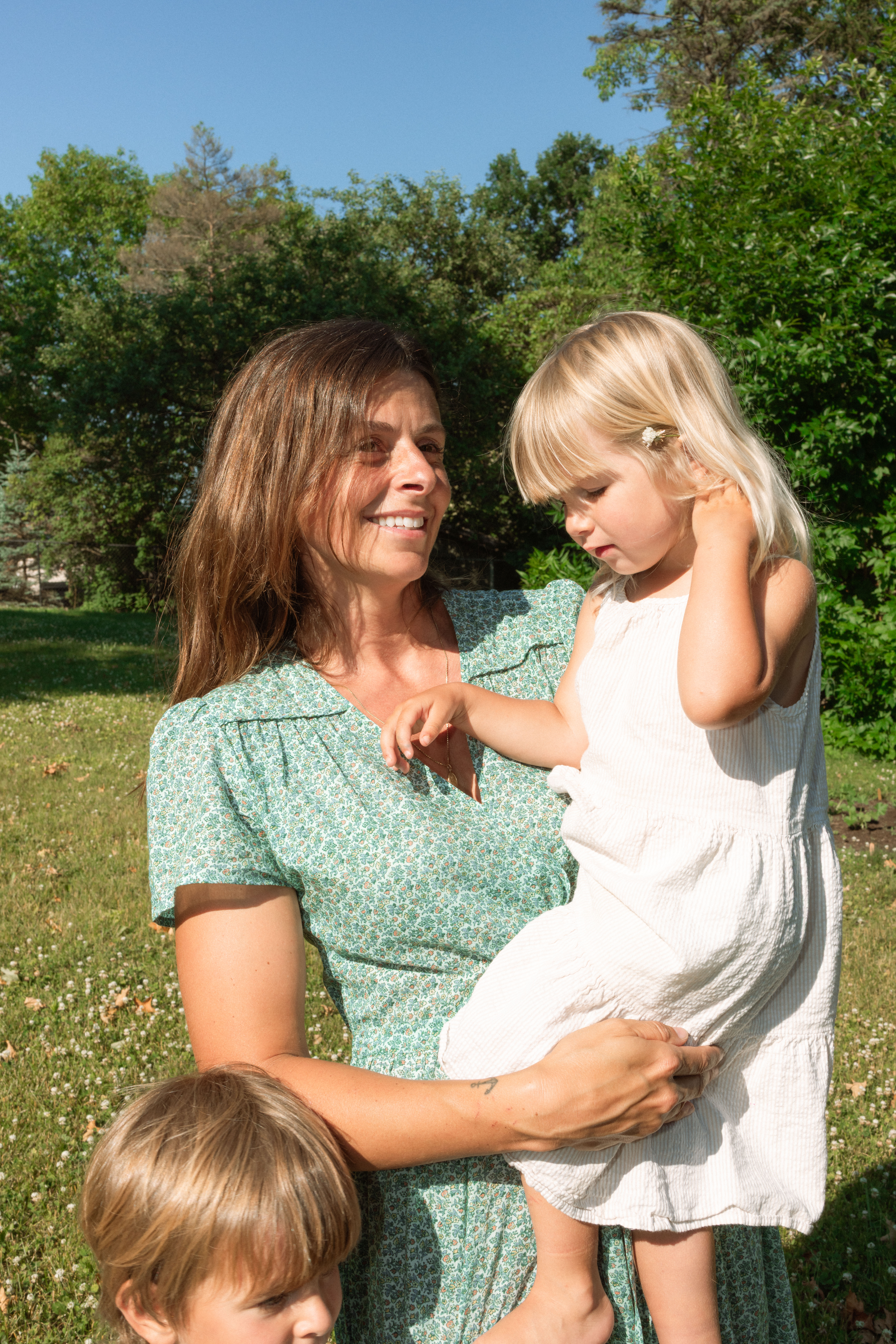 mother holding children during documentary family session