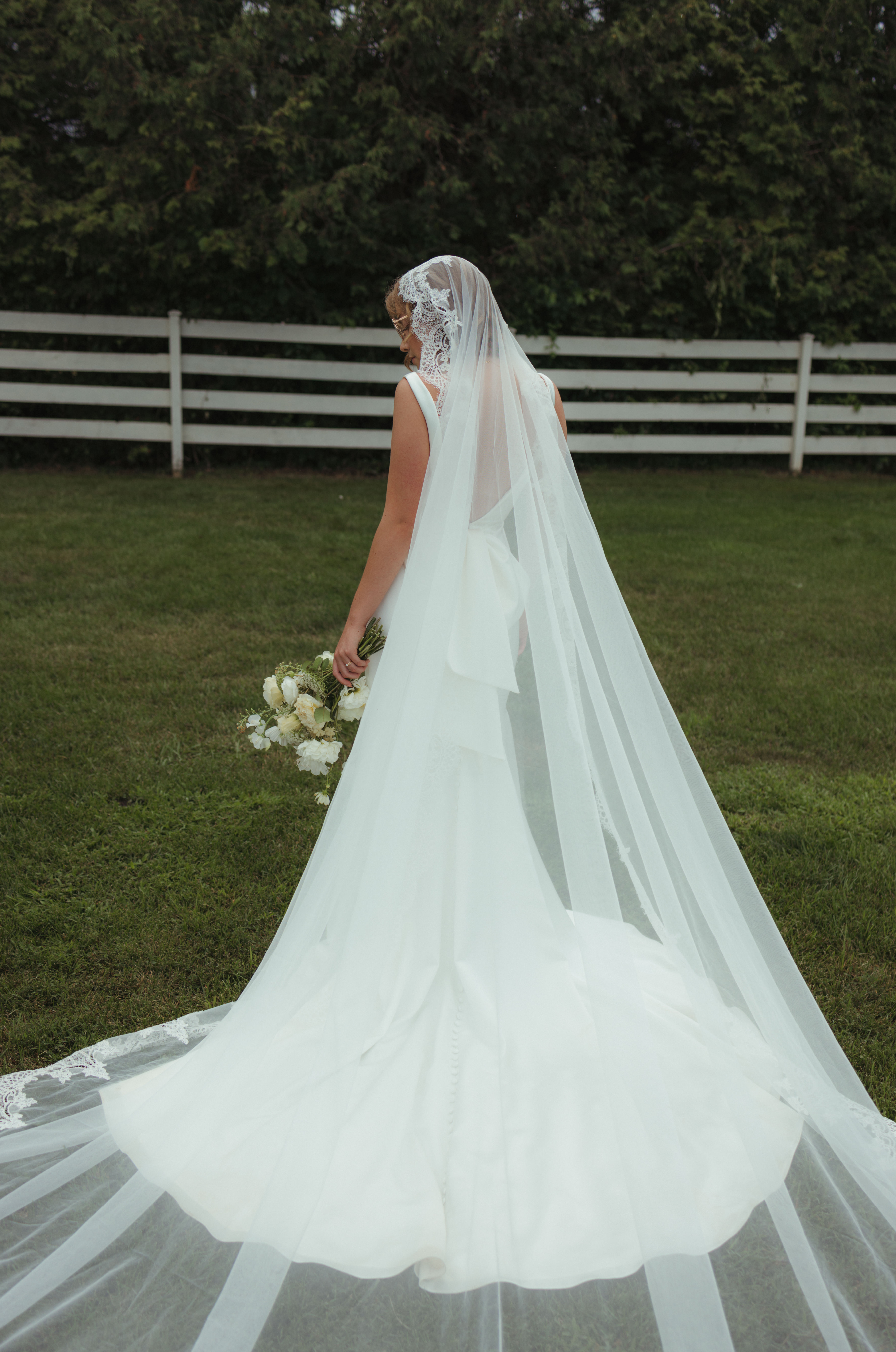 bride in sleek gown with an editorial pose