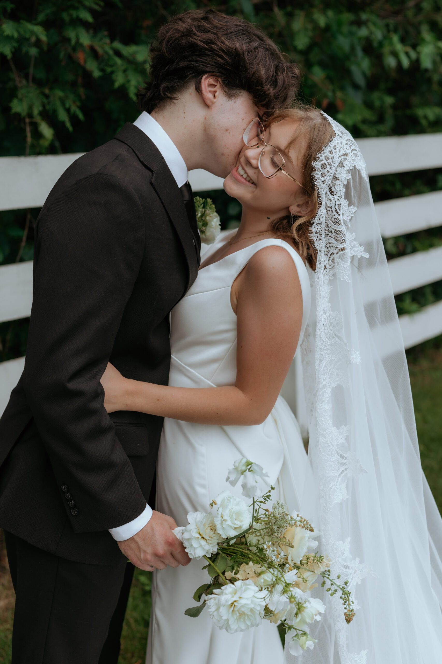 couple kissing at their outdoor wedding venue in ottawa 