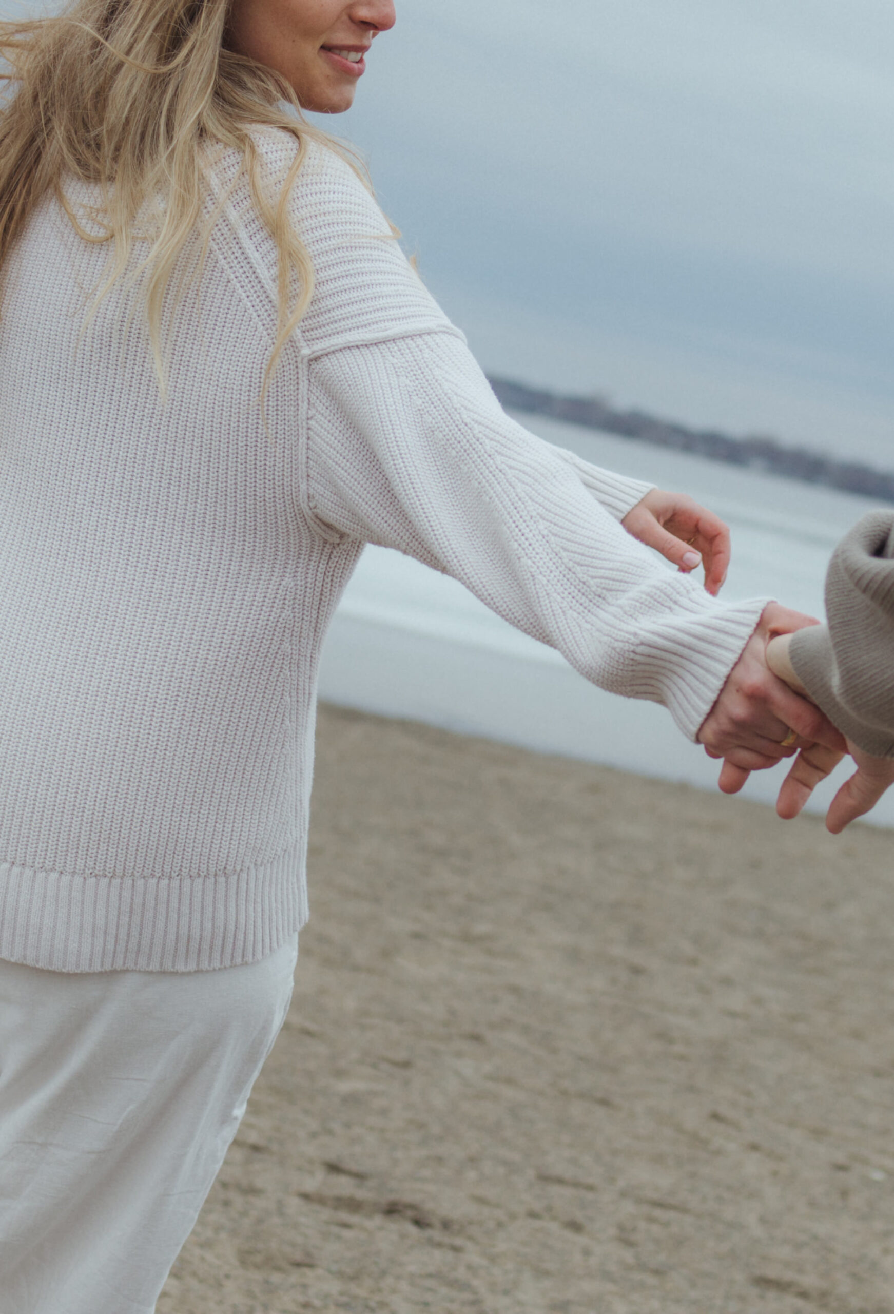 chilly beach engagement session in knits